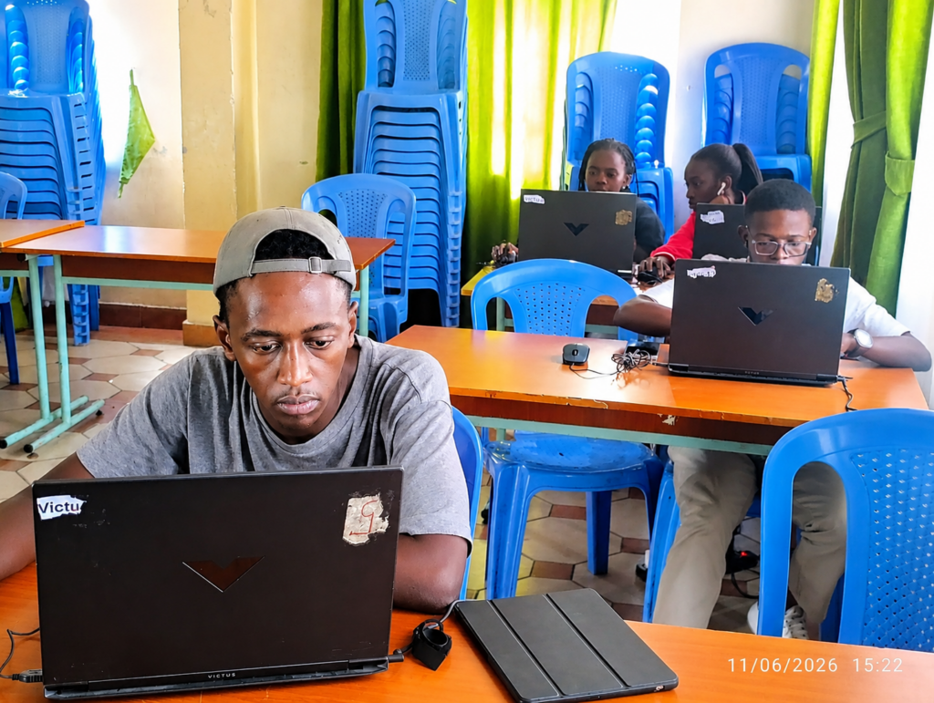 Students participating in an online digital marketing training course in Kenya, learning practical digital marketing skills on laptops during a beginner-friendly digital marketing class.