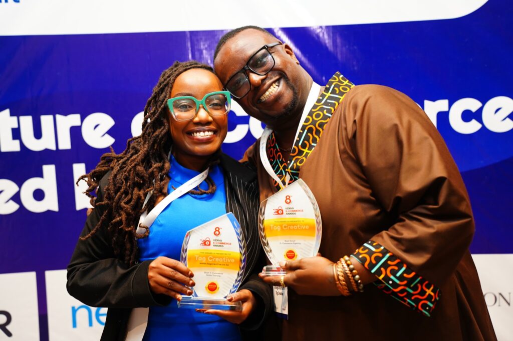 Tag Creative digital marketing co founders Tosh Ruchiami and Freddie Ngunju at the 8th Kenya ecommerce awards holding their two awards one for best ecommerce skills trainer in Kenya and Best ecommerce and the second for best digital marketing and ecommerce agency in Kenya